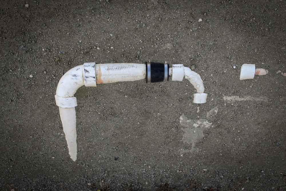 exposed pipe lines sticking out of the ground