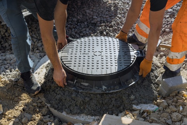 commercial sewer manhole frame and cover installation